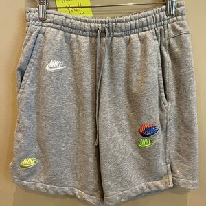 Nike Gray Athletic Shorts with Vibrant Logo Details